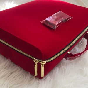 Estée Lauder red zipper cosmetic bag